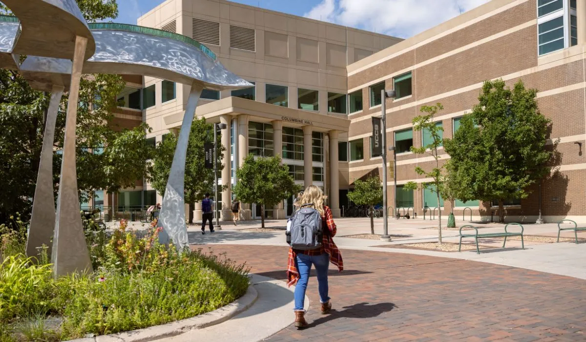 student walking into Columbine Hall